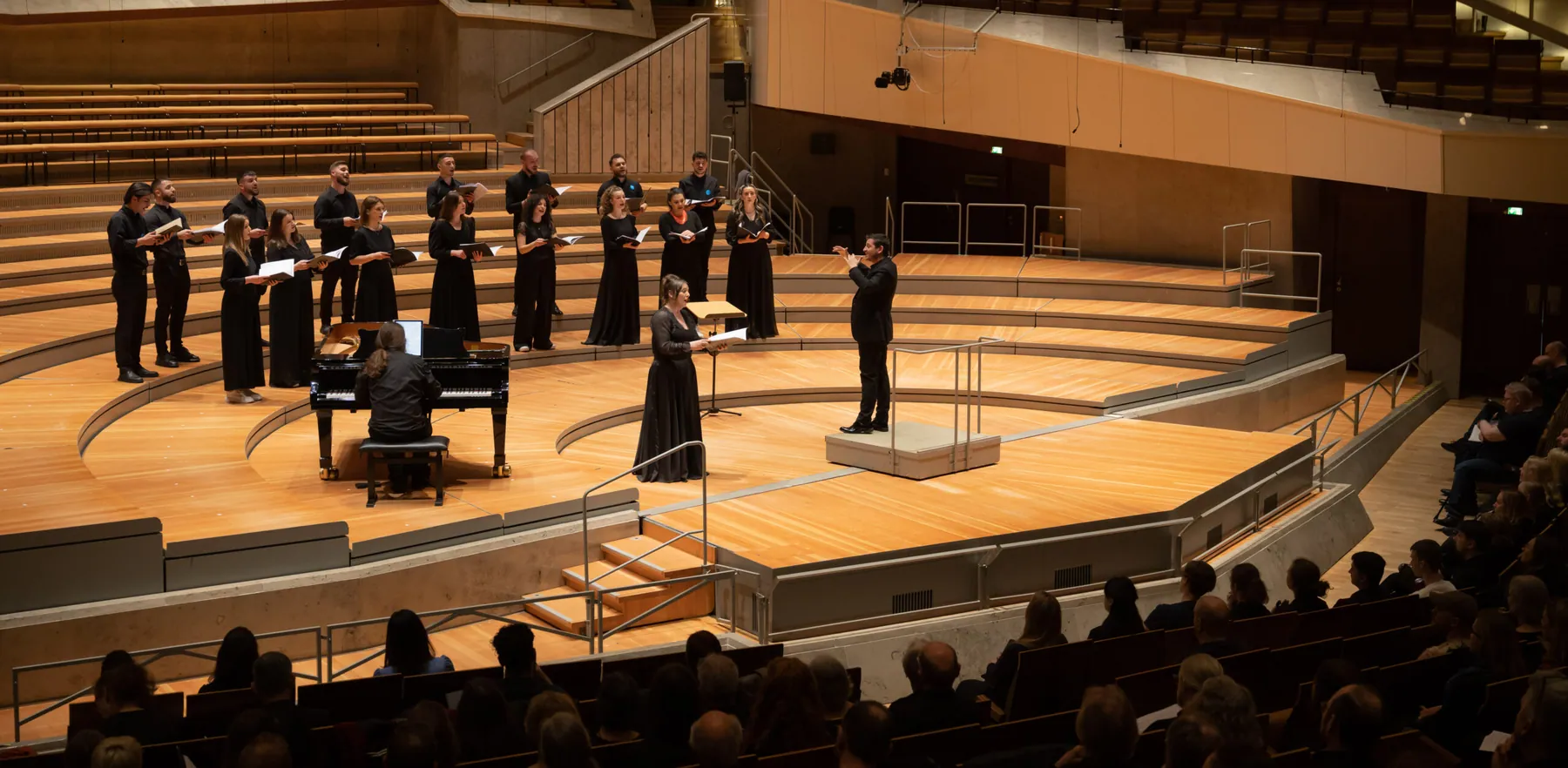Siparantum Choir singers performing on stage during a concert (image 23 of 25)